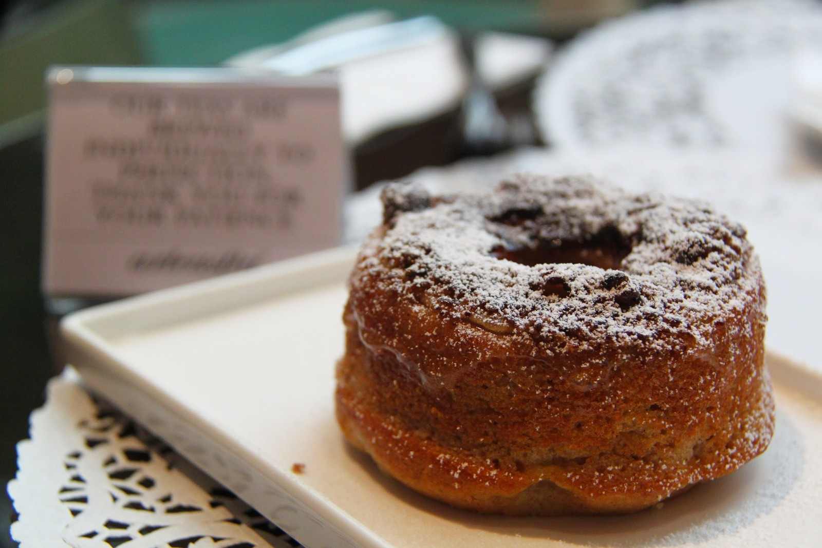 An imaghe of a donut on a wood board